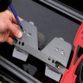 A pair of BasePlates being attached to a foot stretcher